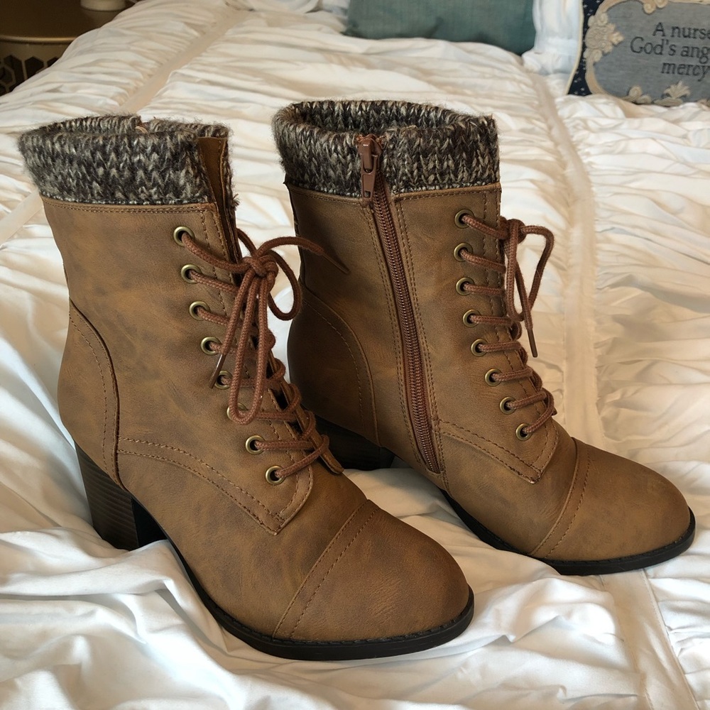 Tan sweater top lace up boots.